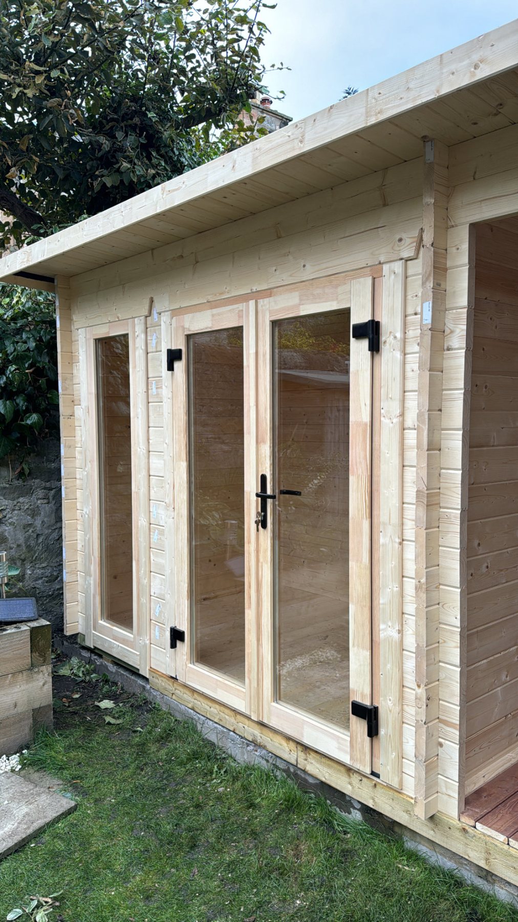 Light natural timber log cabin with double glazed doors and roof overhang | Signature Garden Rooms, Central Scotland