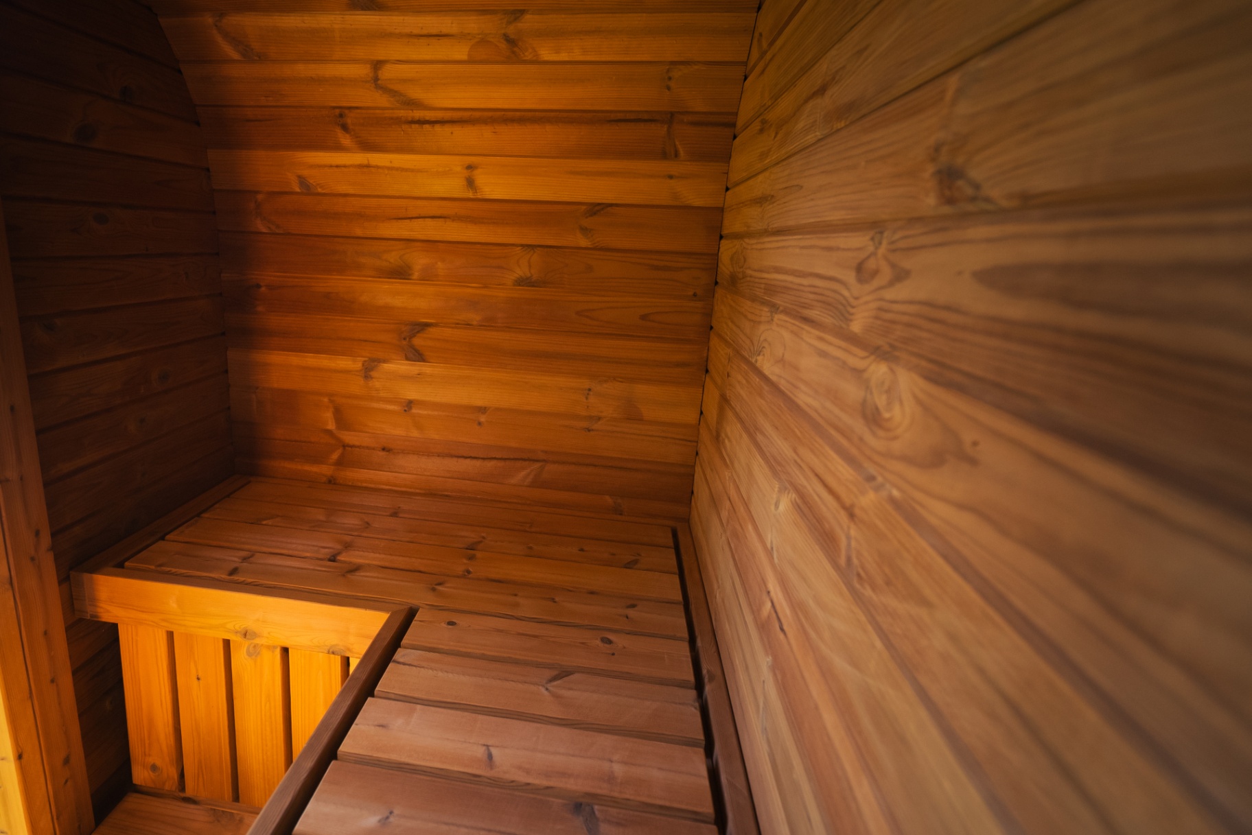 Ula Mini curved cube sauna in teak finish | Signature Garden Rooms