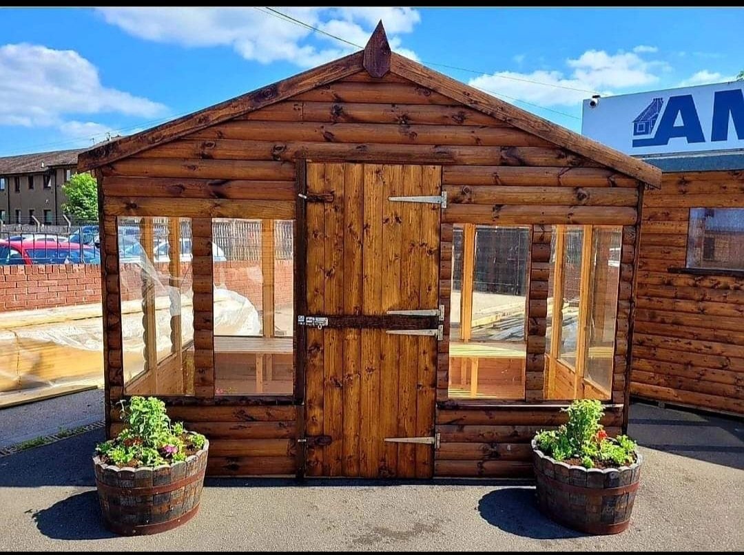 Wooden apex potting shed with central door, large windows, and staging inside | Signature Garden Rooms, Central Scotland