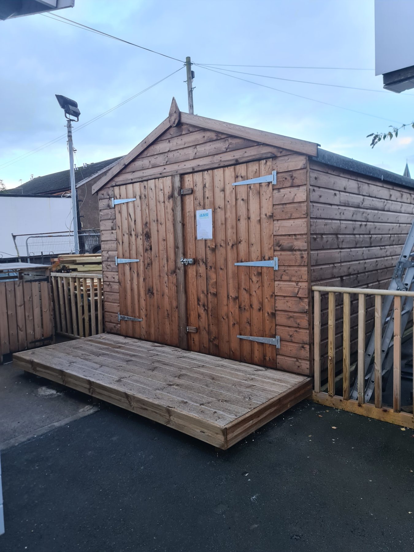 Apex wooden garden shed featuring double doors and a small timber decking step | Signature Garden Rooms, Central Scotland