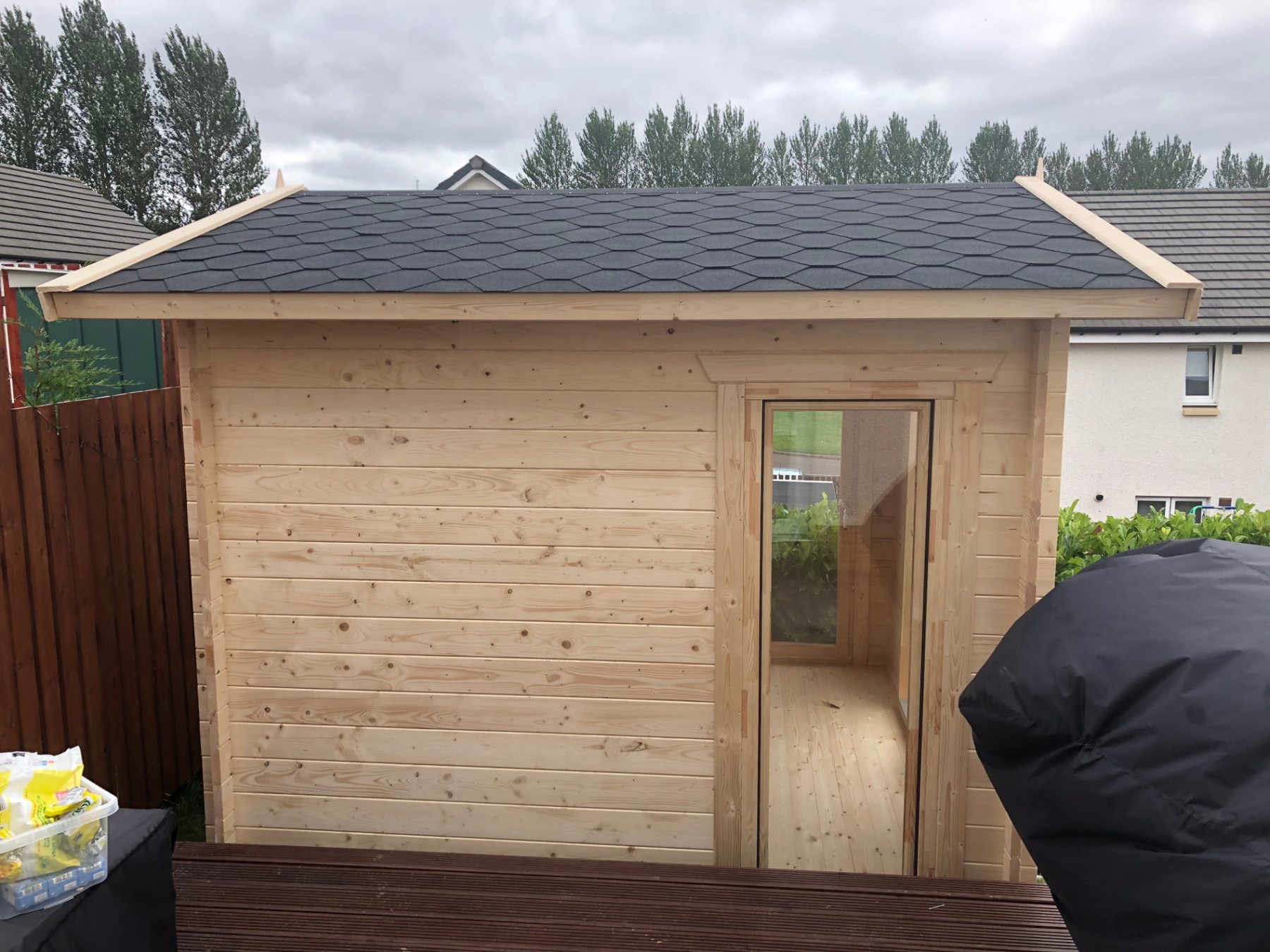 Small wooden log cabin with apex tiled roof and glazed entrance door | Signature Garden Rooms, Central Scotland