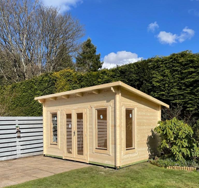 Natural timber pent roof log cabin with glazed double doors set on lawn | Signature Garden Rooms, Central Scotland