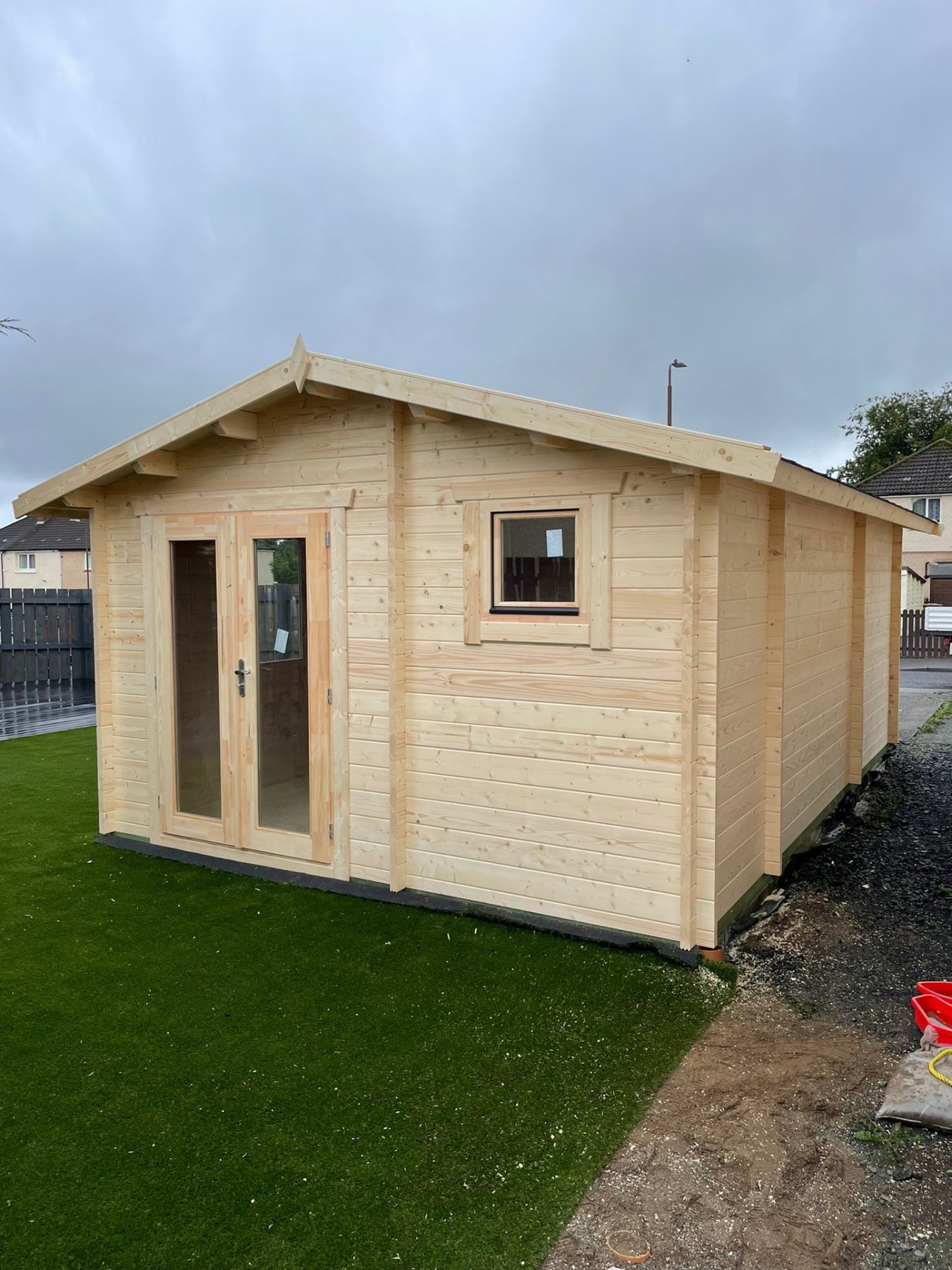 Natural untreated timber log cabin with apex roof and double glass doors | Signature Garden Rooms, Central Scotland