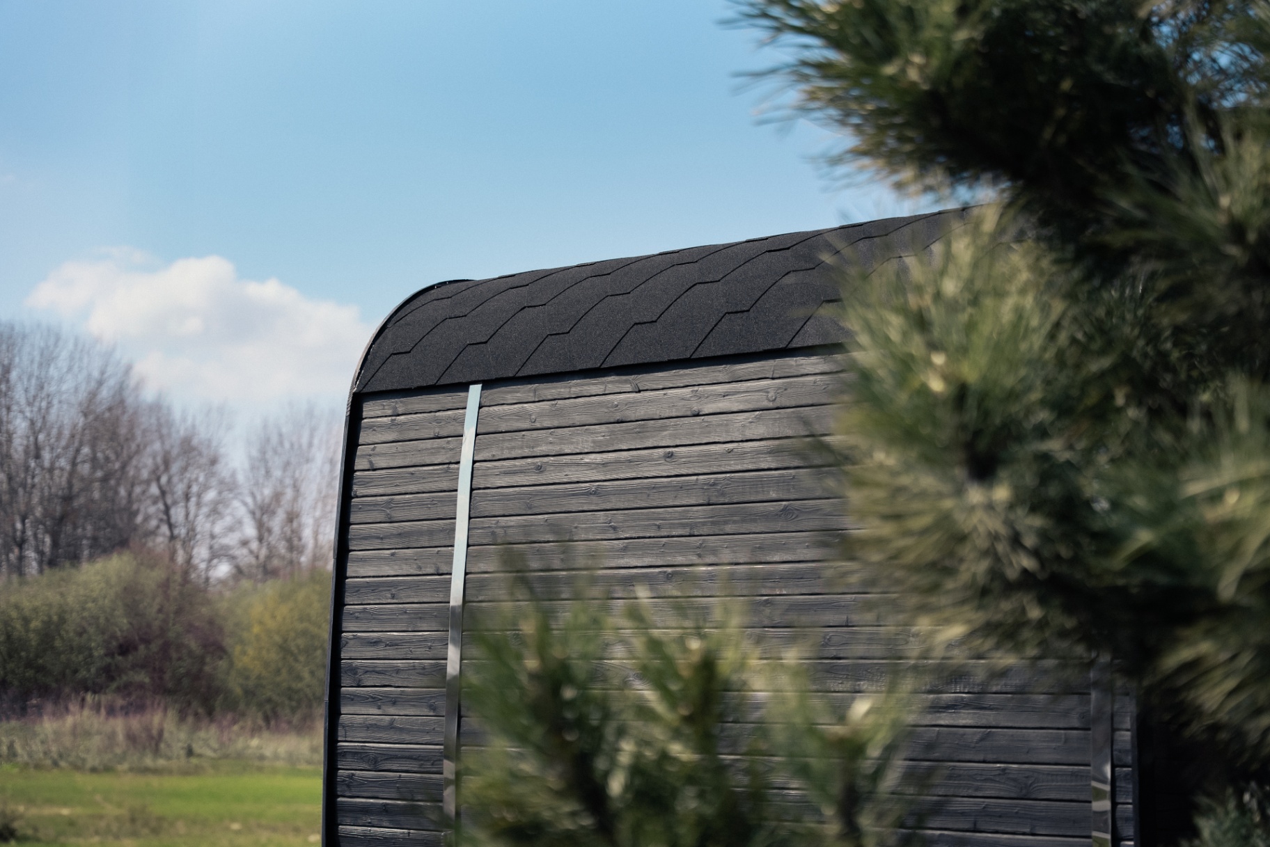 Ula L curved-corner cube sauna in ebony charred finish | Signature Garden Rooms Scotland
