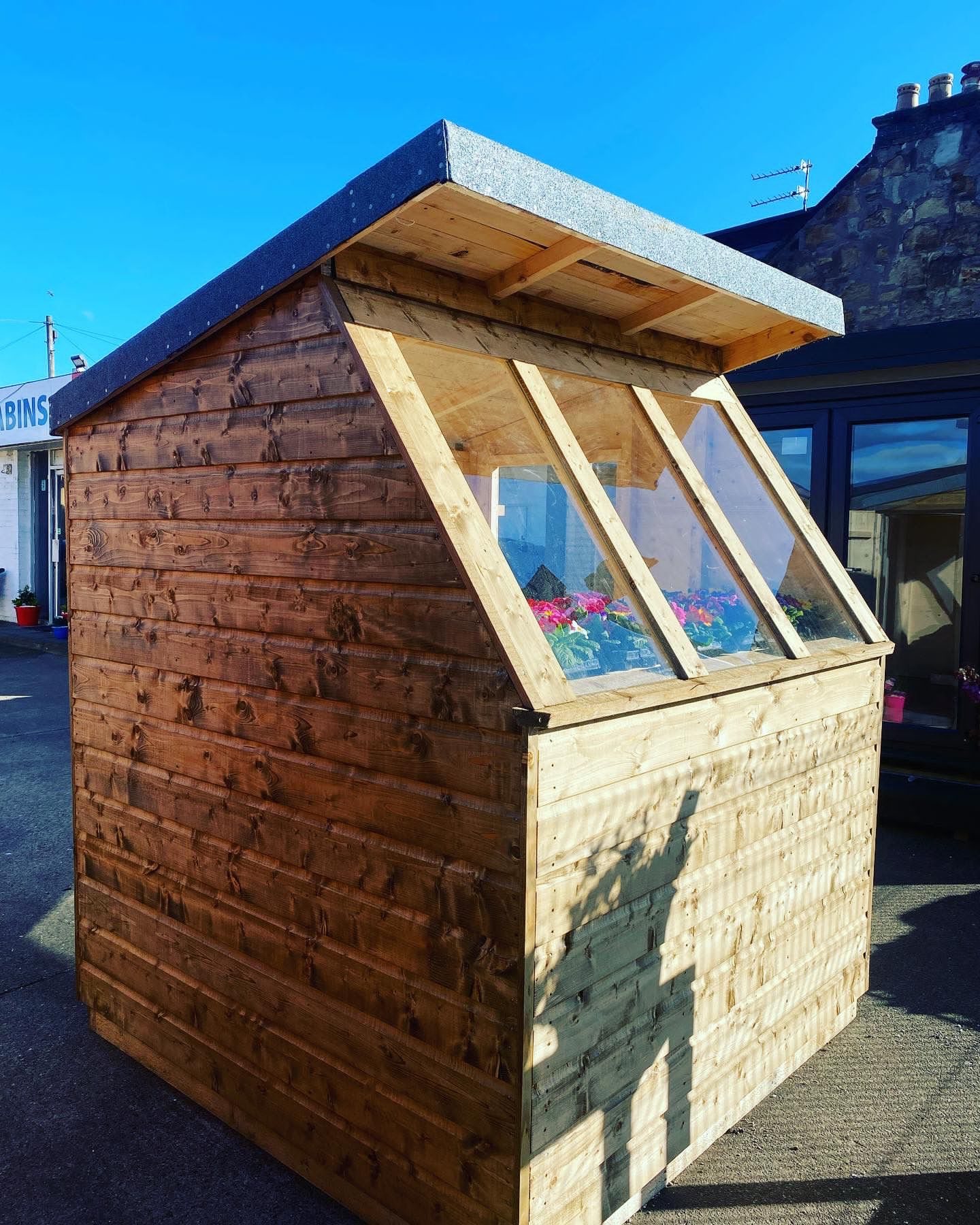 Small wooden potting shed with large sloped front glass windows for plants | Signature Garden Rooms, Central Scotland