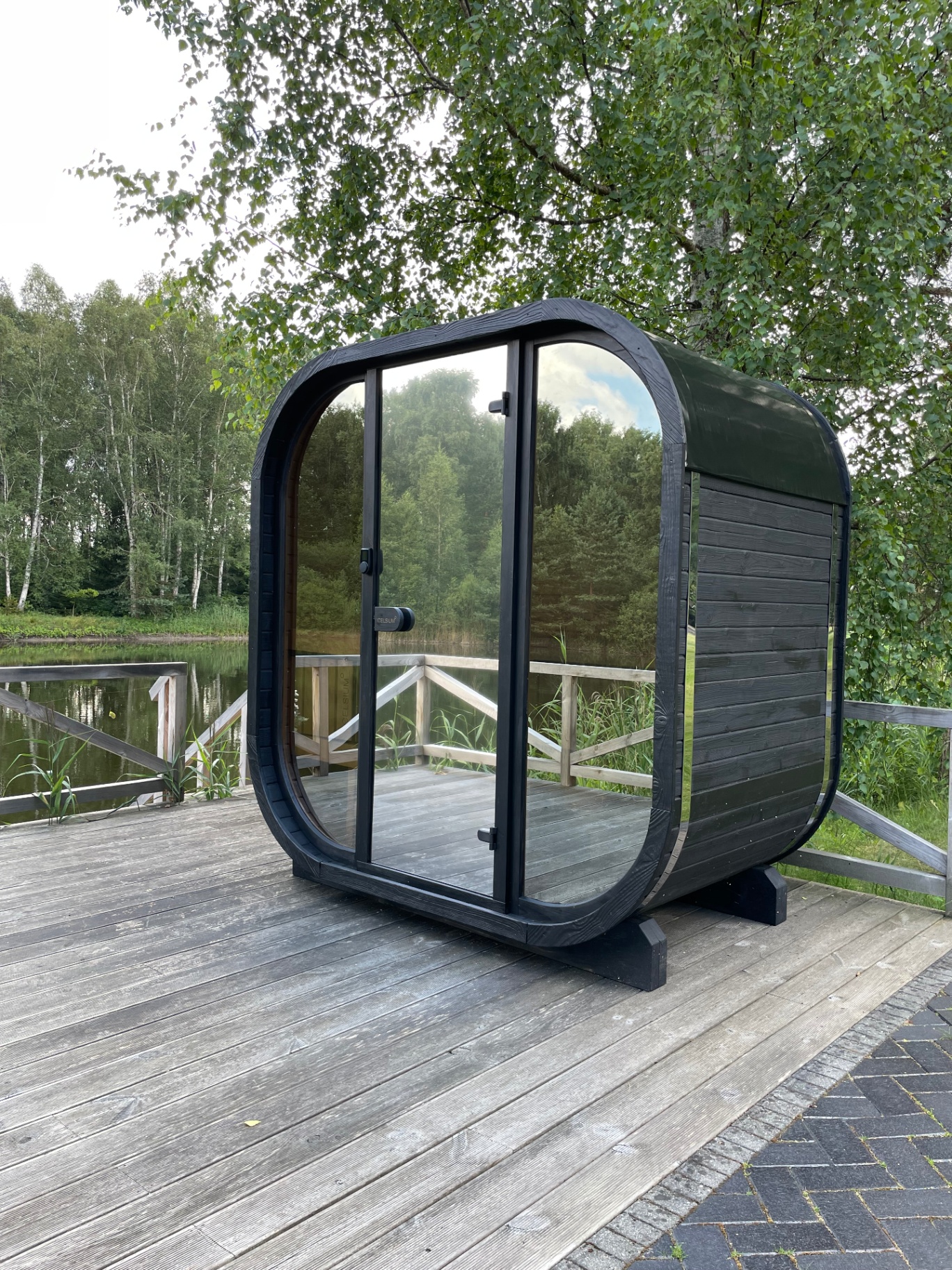 Ula Mini curved cube sauna in ebony charred finish | Signature Garden Rooms