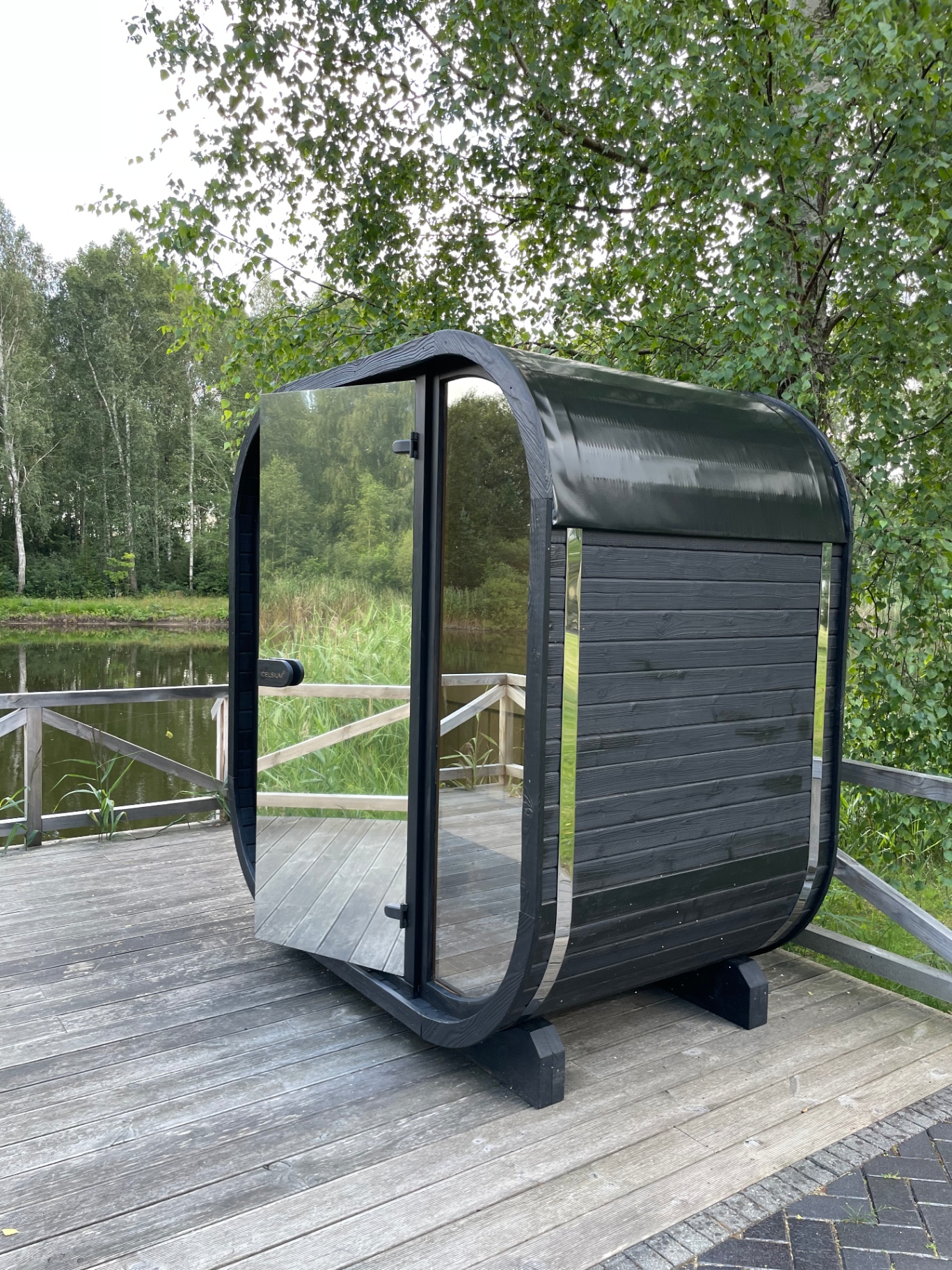 Ula Mini curved cube sauna in ebony charred finish | Signature Garden Rooms
