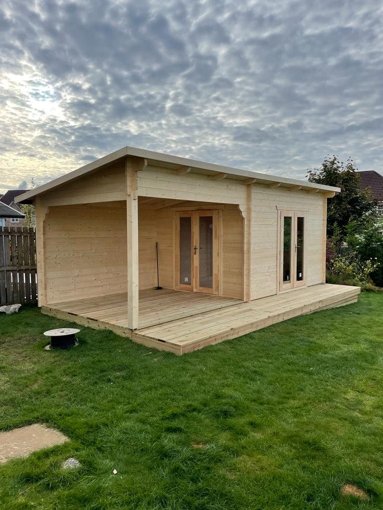 Natural timber log cabin featuring an integrated open veranda and wooden double doors | Signature Garden Rooms, Central Scotland