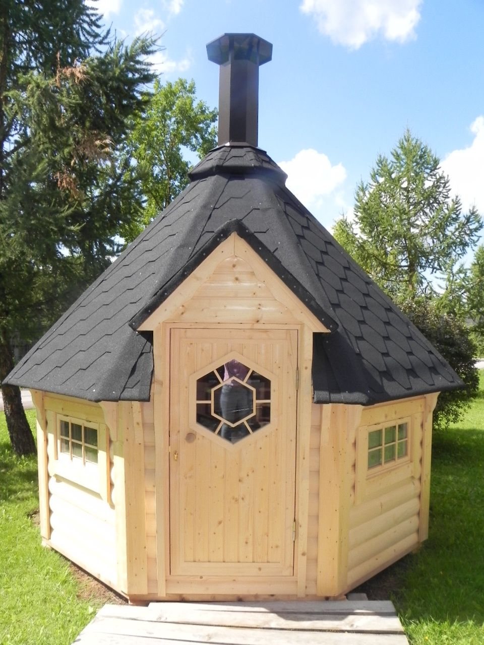 Traditional timber hexagonal BBQ hut featuring a shingled roof and central chimney | Signature Garden Rooms, Central Scotland