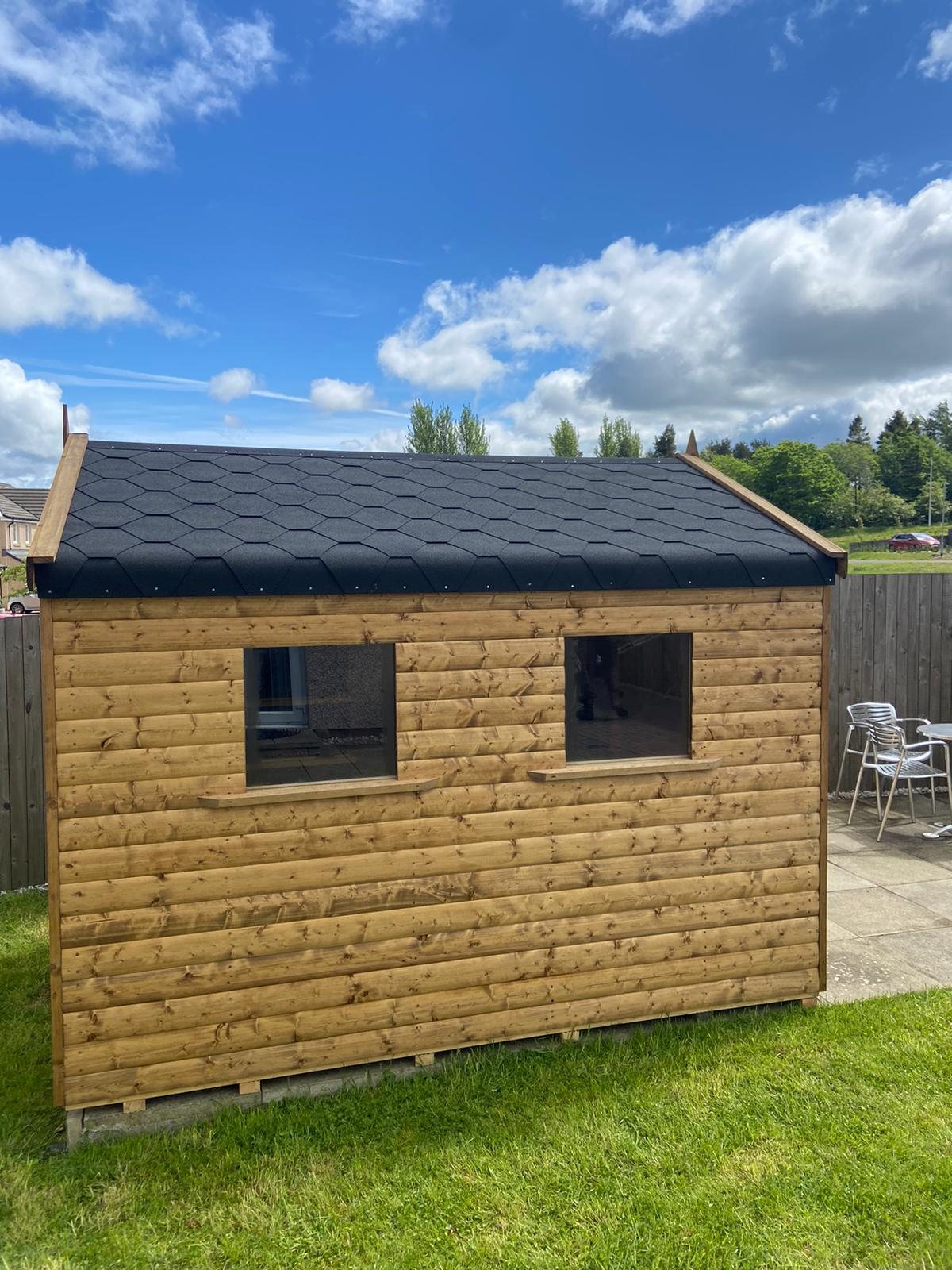 A wooden garden shed featuring two windows and black shingled apex roof | Signature Garden Rooms, Central Scotland