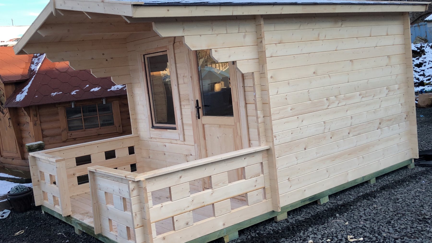 Small untreated timber log cabin with front porch canopy and single window | Signature Garden Rooms, Central Scotland
