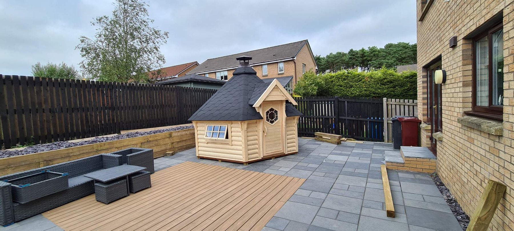 Timber traditional BBQ hut installed in a paved residential back garden | Signature Garden Rooms, Central Scotland