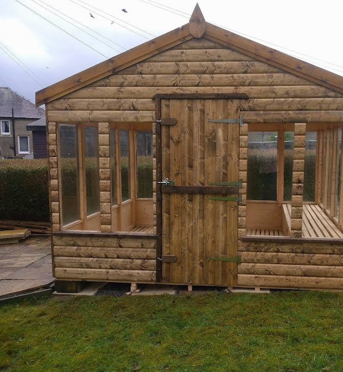 A wooden apex potting shed with large glass windows and central door | Signature Garden Rooms, Central Scotland