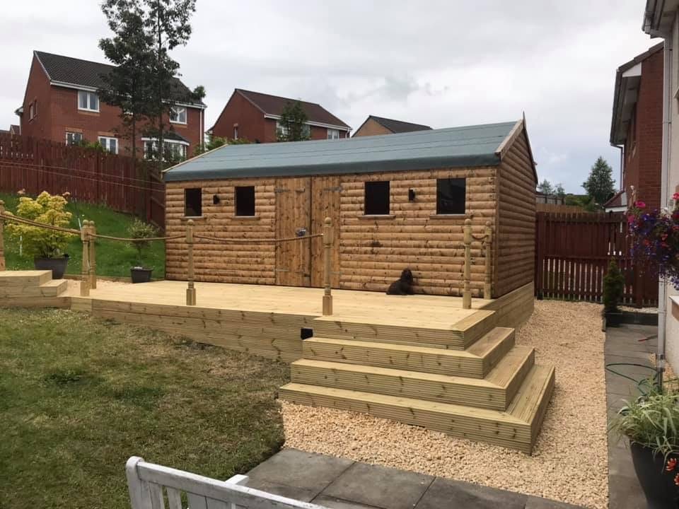 Large timber garden shed set on raised wooden decking with access steps | Signature Garden Rooms, Central Scotland