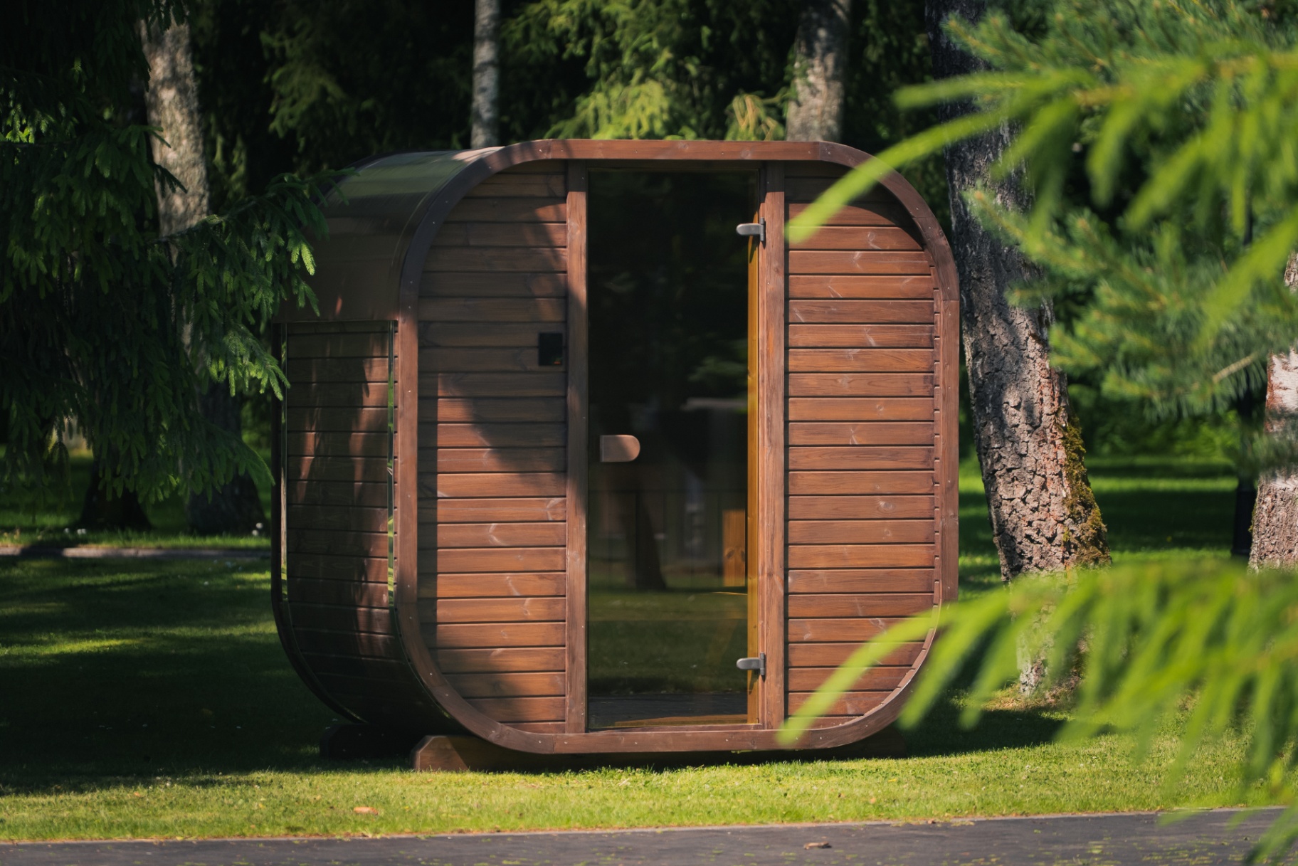 Ula Mini curved cube sauna in teak finish | Signature Garden Rooms