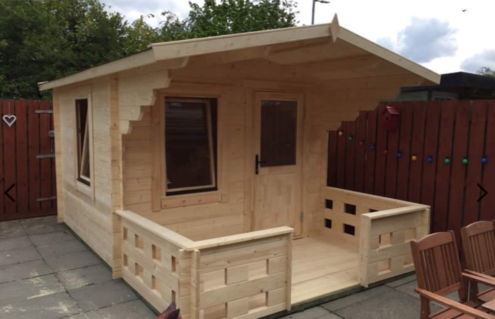 Small natural timber log cabin with covered front porch canopy on paved patio | Signature Garden Rooms, Central Scotland