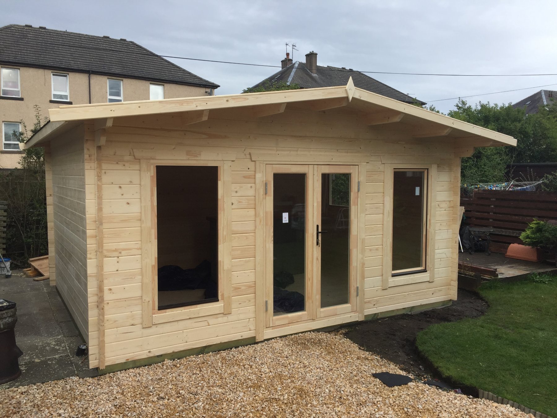 Unfinished light wood log cabin with central double glass doors | Signature Garden Rooms, Central Scotland