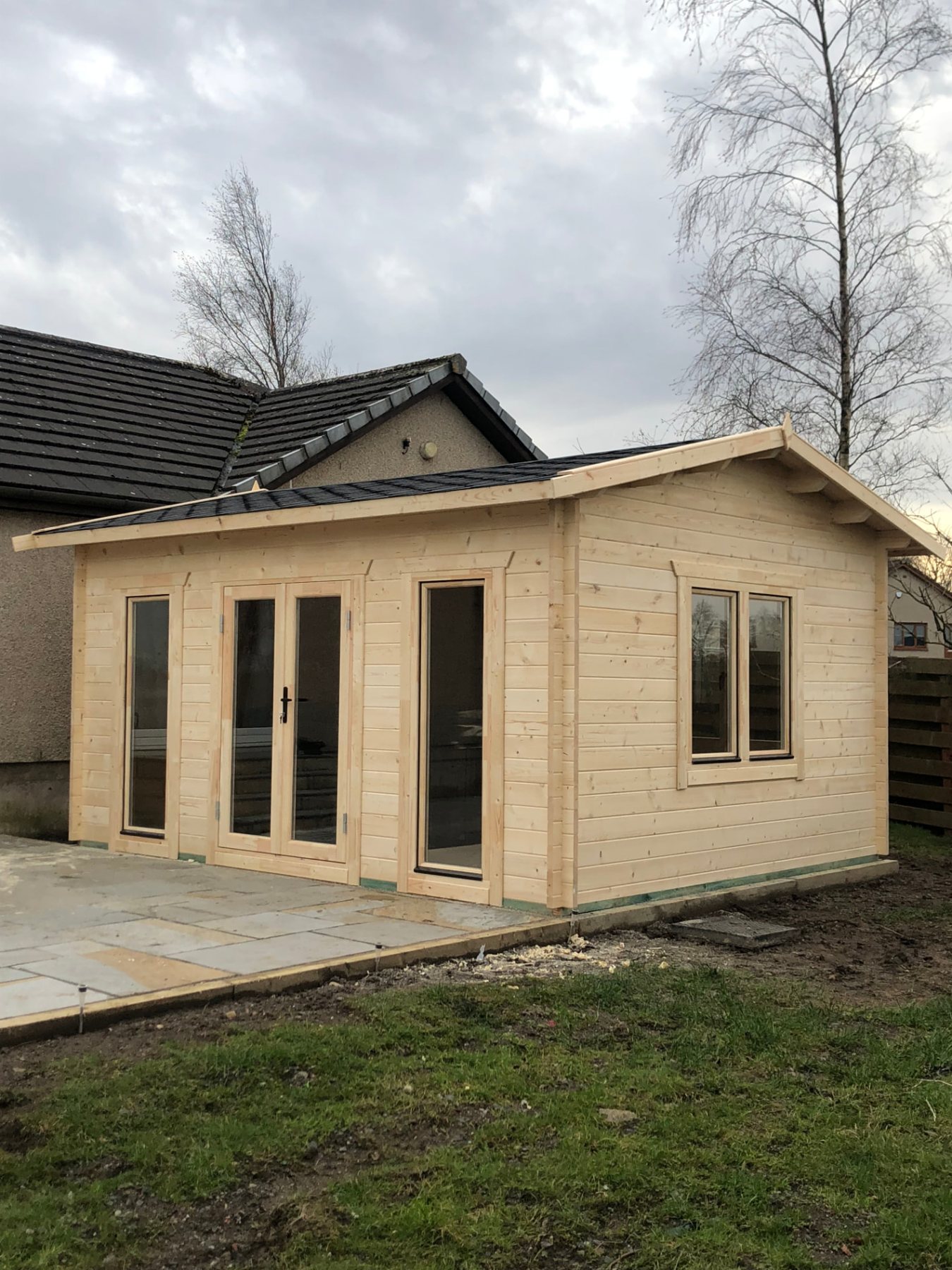Light timber log cabin with double glass doors and tall side windows | Signature Garden Rooms, Central Scotland