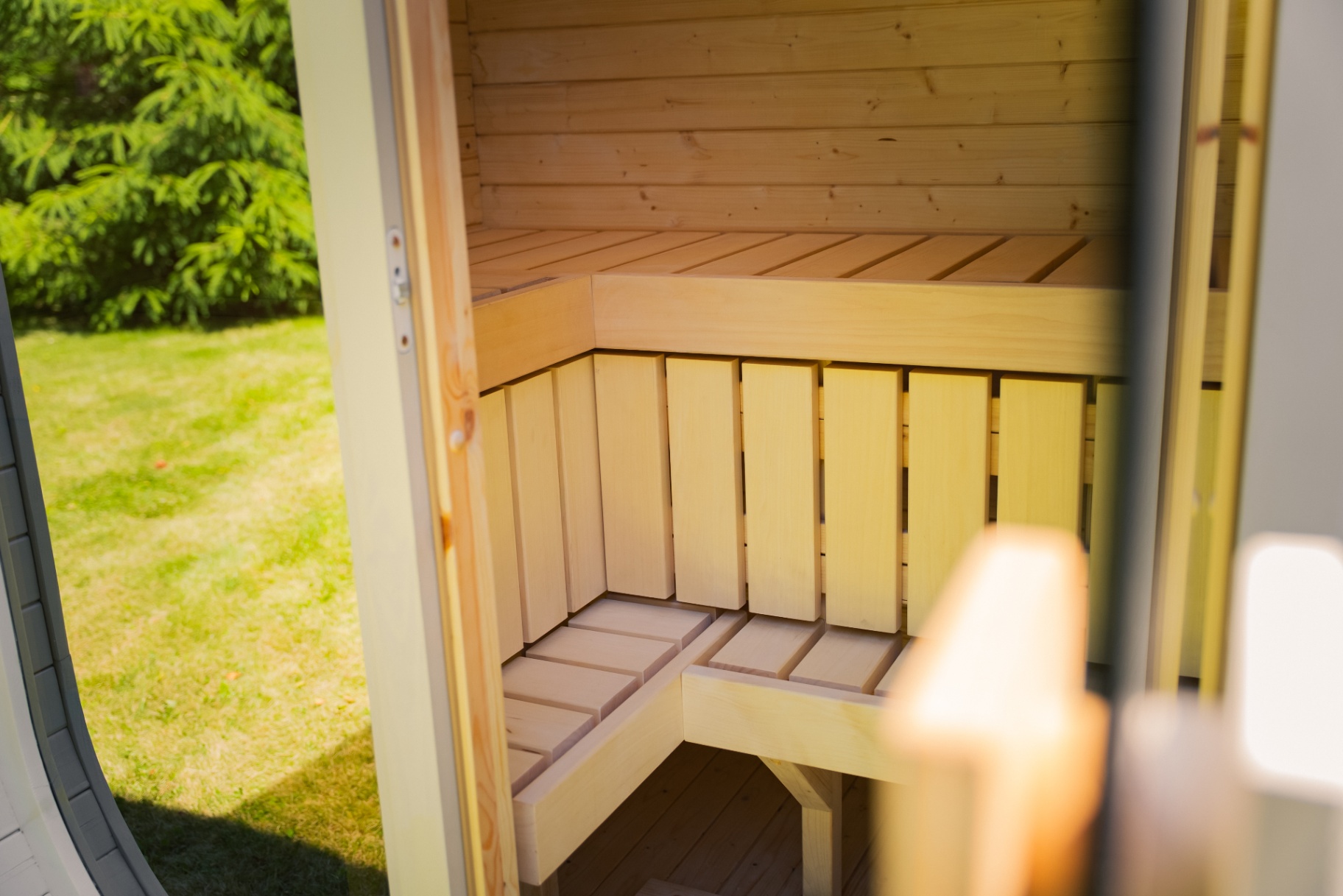 Ula Mini curved cube sauna in beige cedar finish | Signature Garden Rooms