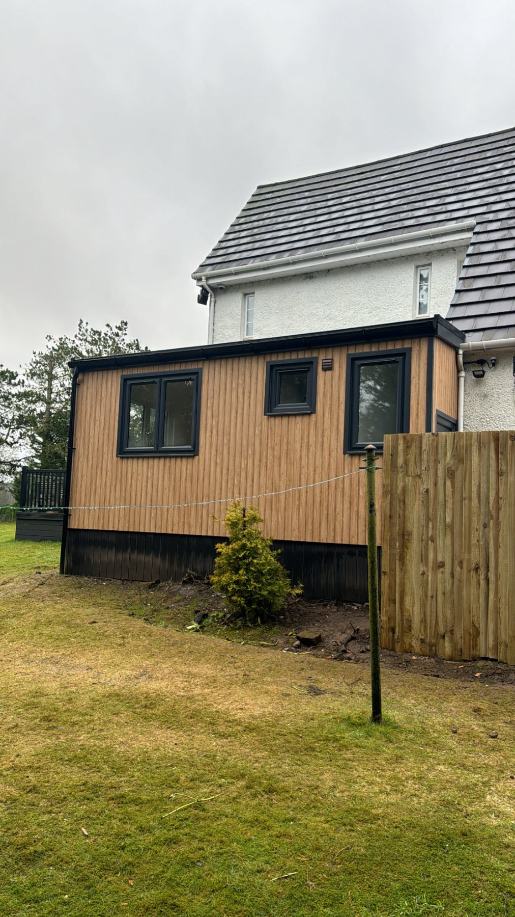 Modern timber clad garden room extension attached to side of a residential house | Signature Garden Rooms, Central Scotland
