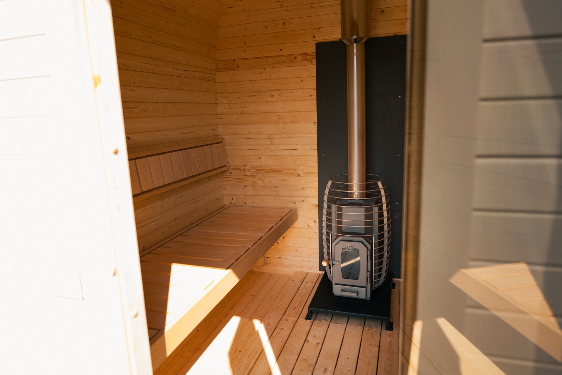 Ula L curved-corner cube sauna in beige cedar finish | Signature Garden Rooms Scotland