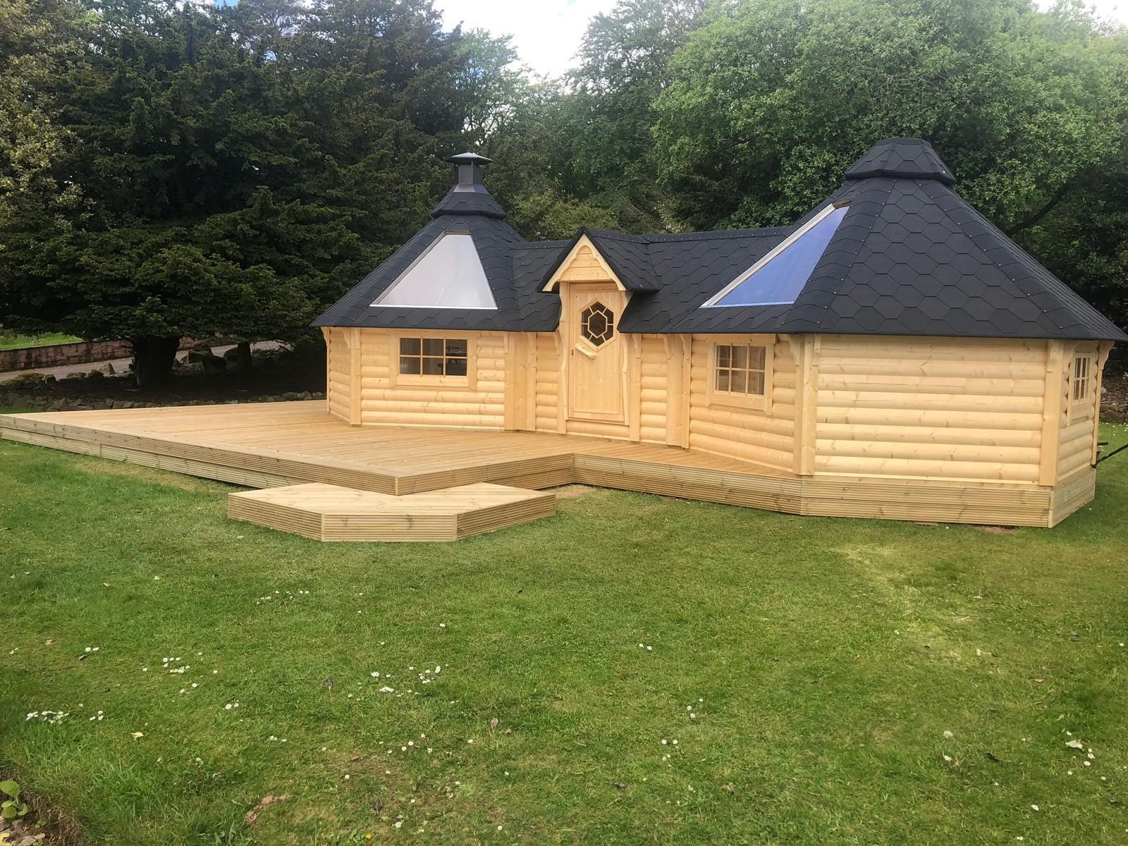 Large wooden double BBQ hut with black shingle roof and surrounding decking area | Signature Garden Rooms, Central Scotland