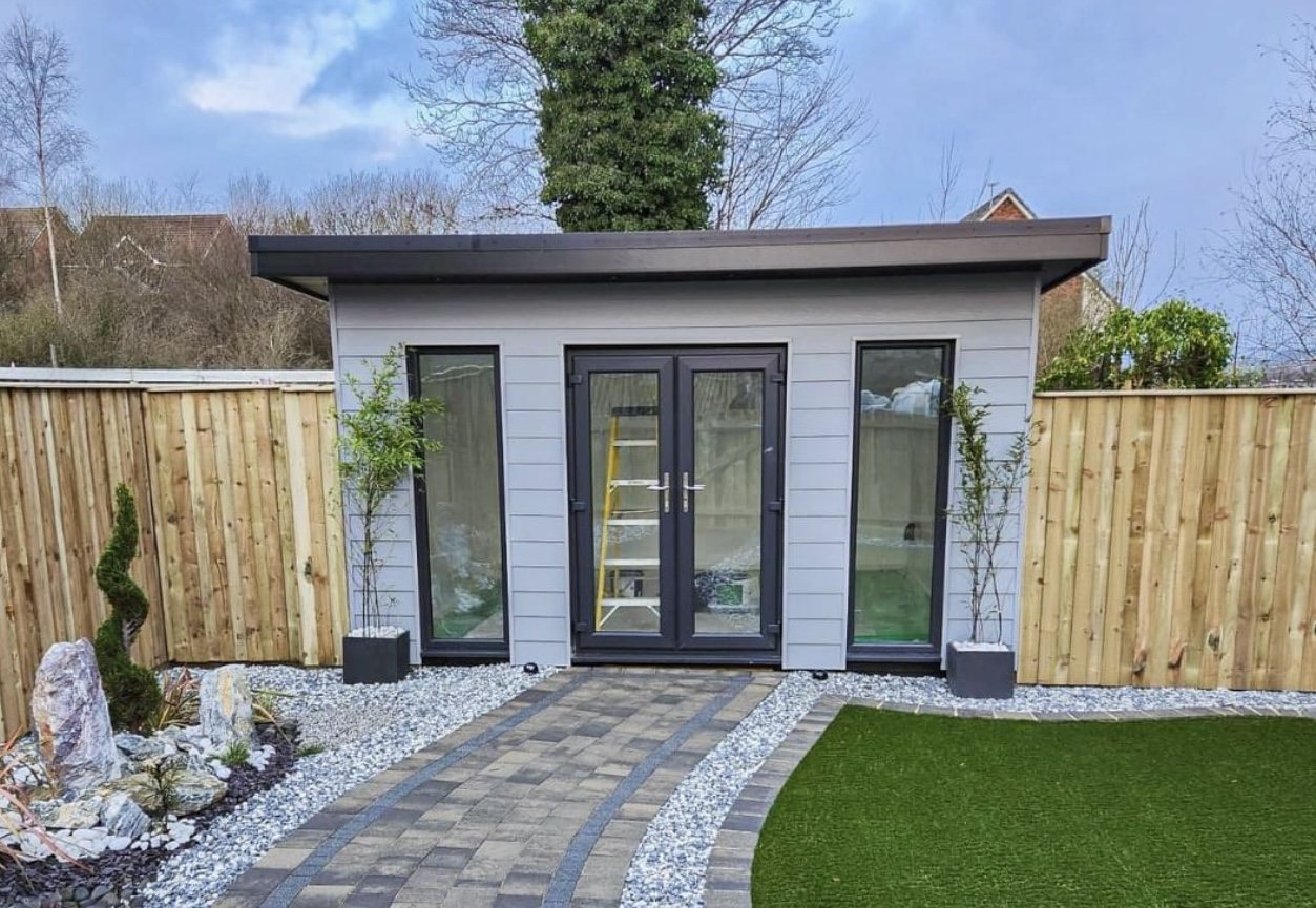 Modern grey garden room with French doors and paved garden pathway | Signature Garden Rooms, Central Scotland