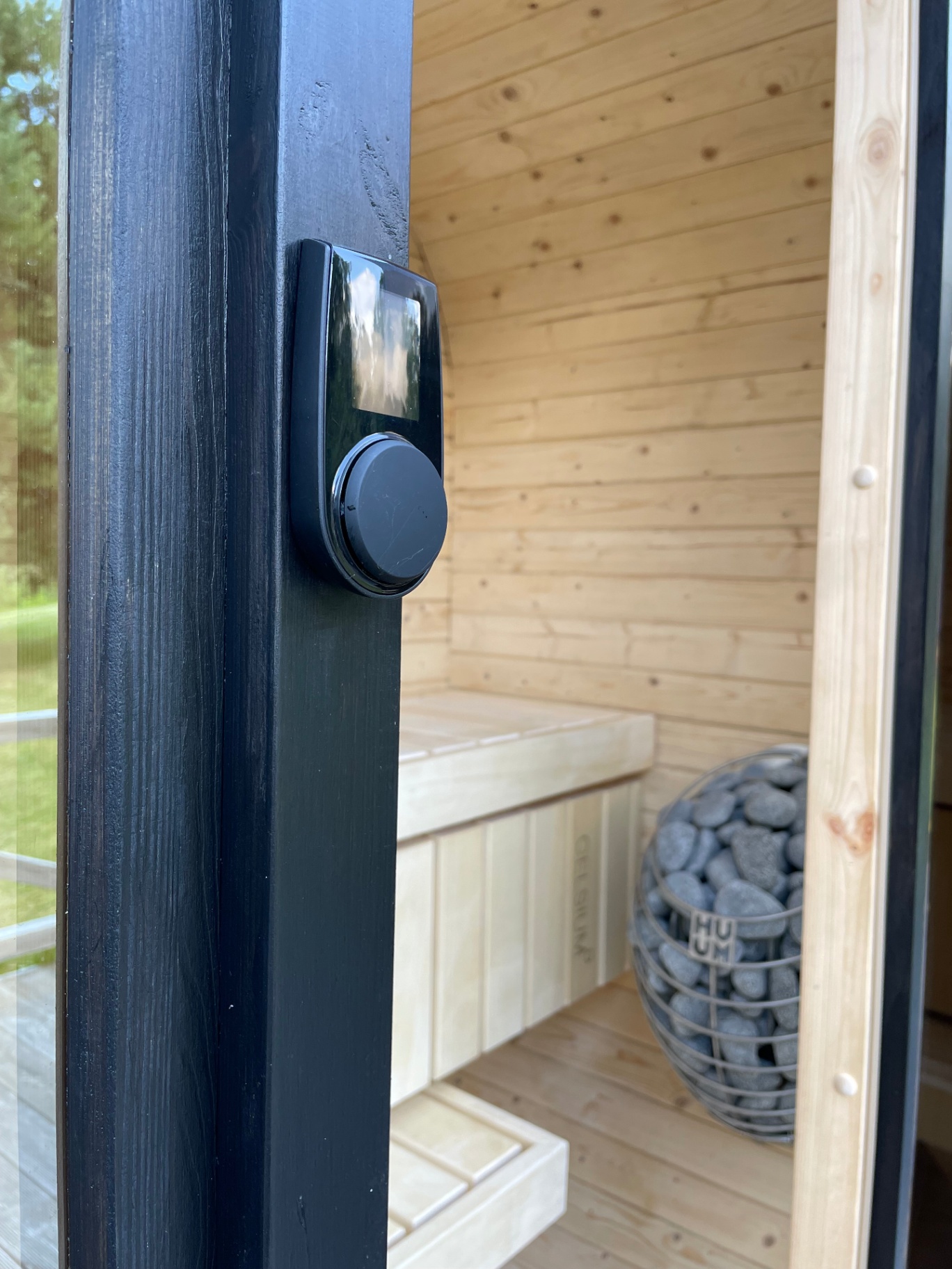 Ula Mini curved cube sauna in ebony charred finish | Signature Garden Rooms