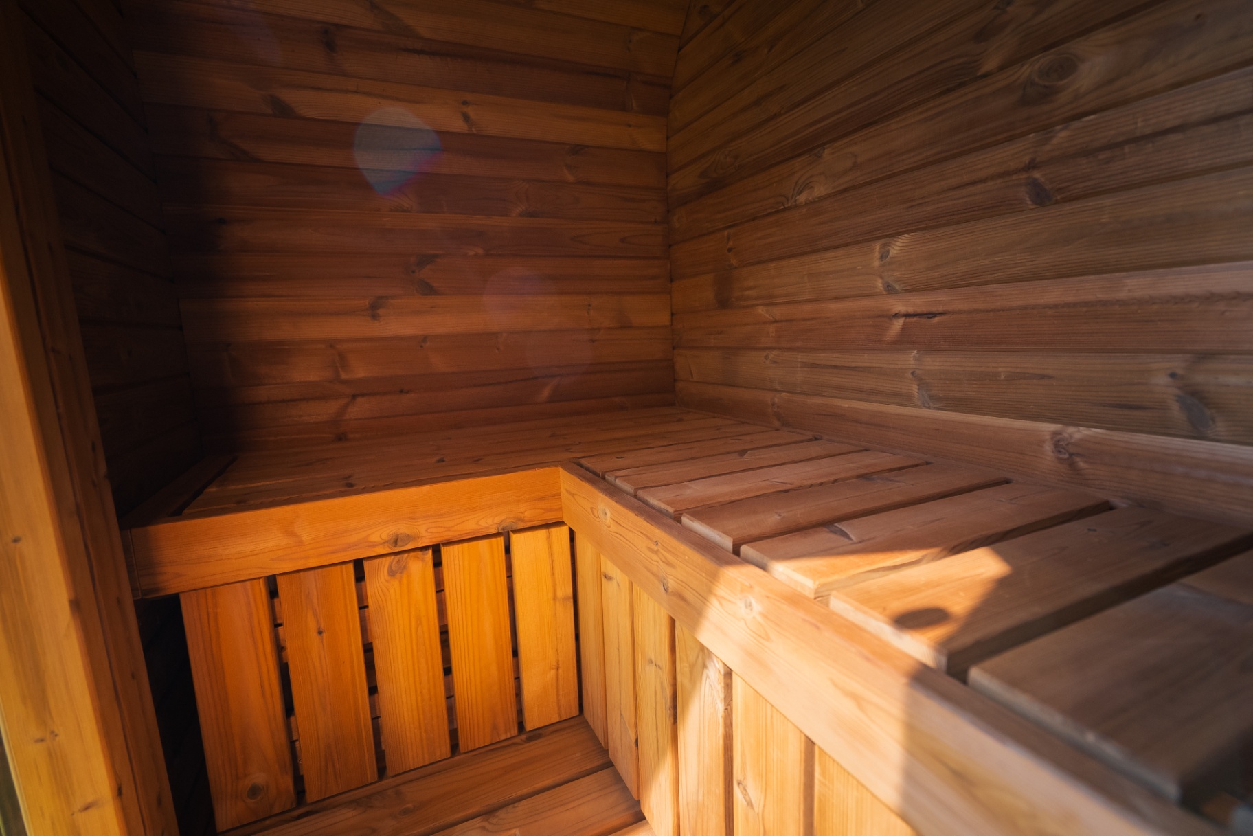 Ula Mini curved cube sauna in teak finish | Signature Garden Rooms