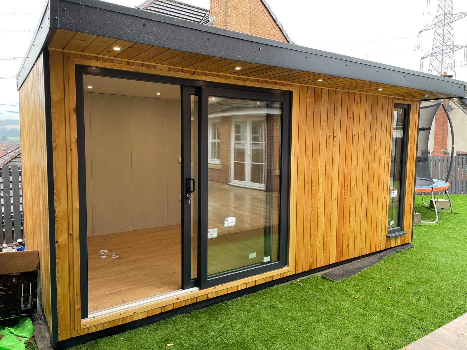 Modern timber clad garden room with sliding glazed doors and roof spotlights | Signature Garden Rooms, Central Scotland
