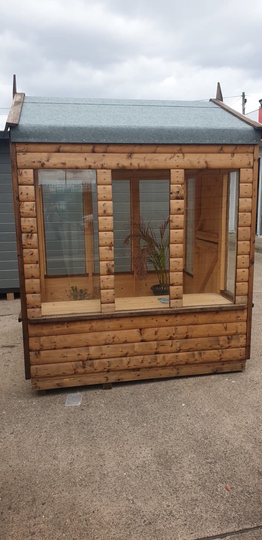 Small timber potting shed featuring large front glass windows and internal plant staging | Signature Garden Rooms, Central Scotland