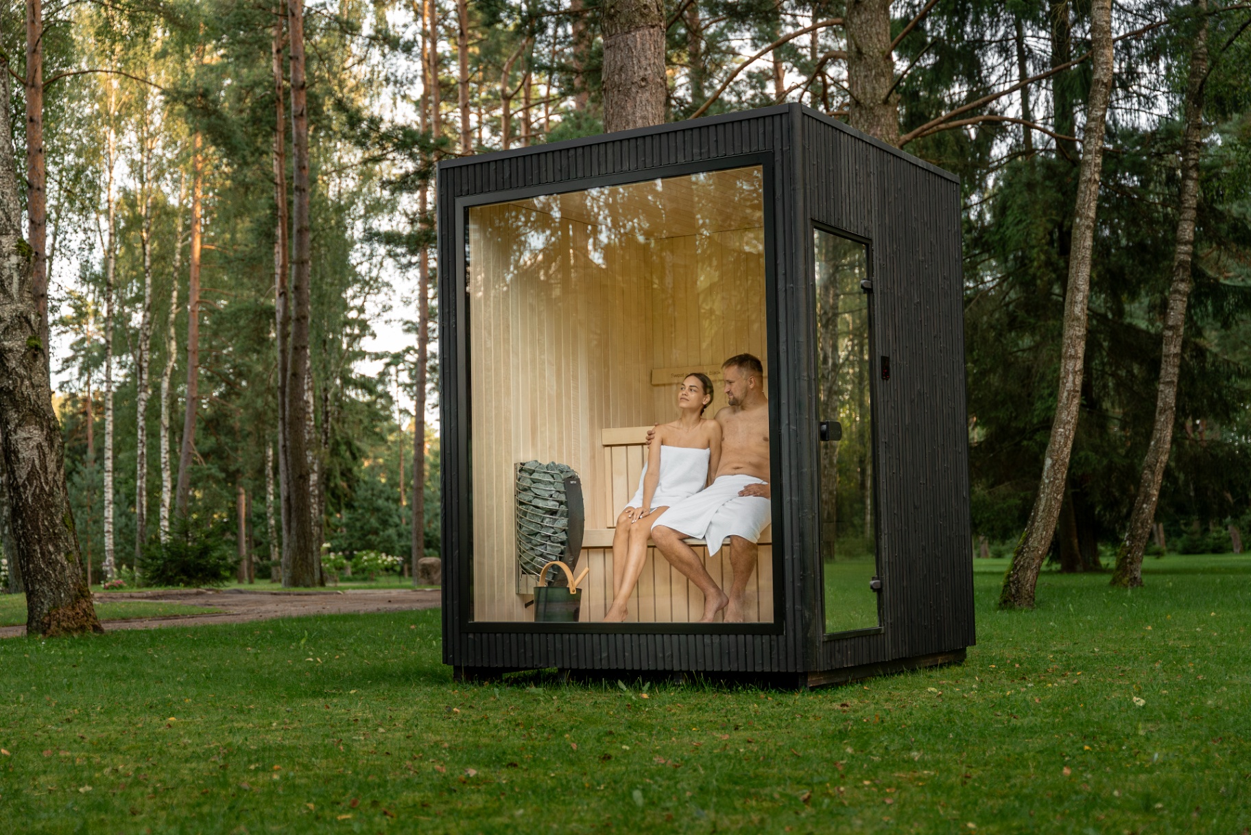 Ebony sauna with Harvia heater and mirror-door clear glass | Signature Garden Rooms