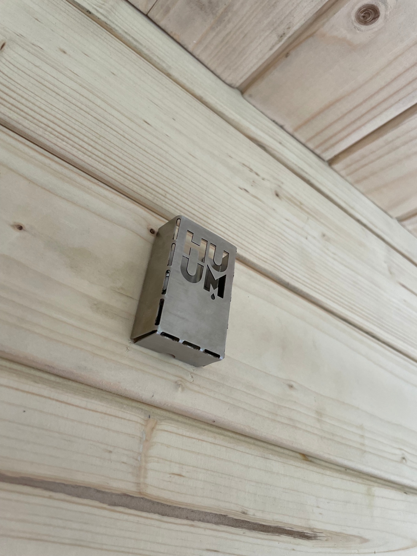 Ula Mini curved cube sauna in ebony charred finish | Signature Garden Rooms