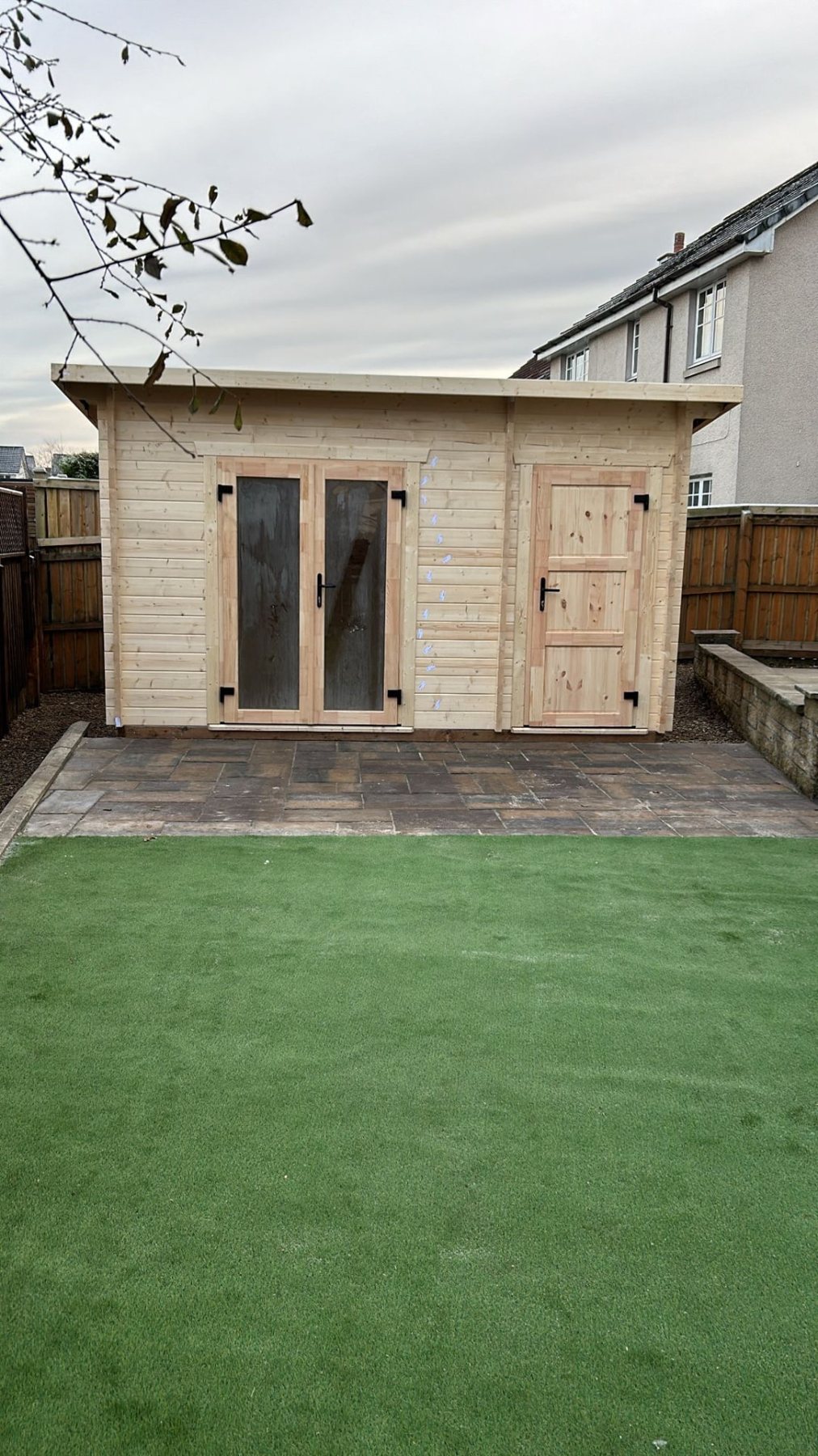 Light timber log cabin with glazed doors and attached side shed door | Signature Garden Rooms, Central Scotland