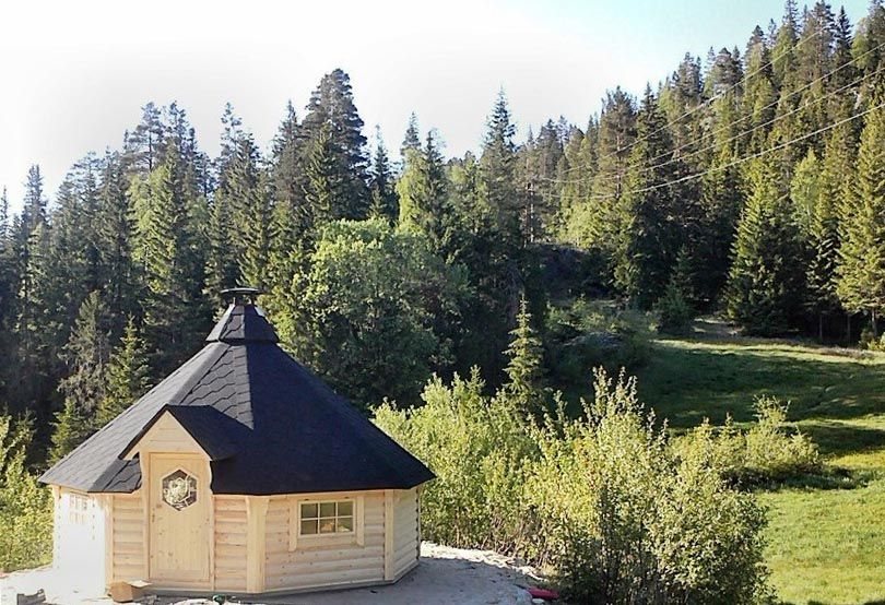 Traditional wooden BBQ hut with dark shingled roof set in woodland countryside | Signature Garden Rooms, Central Scotland