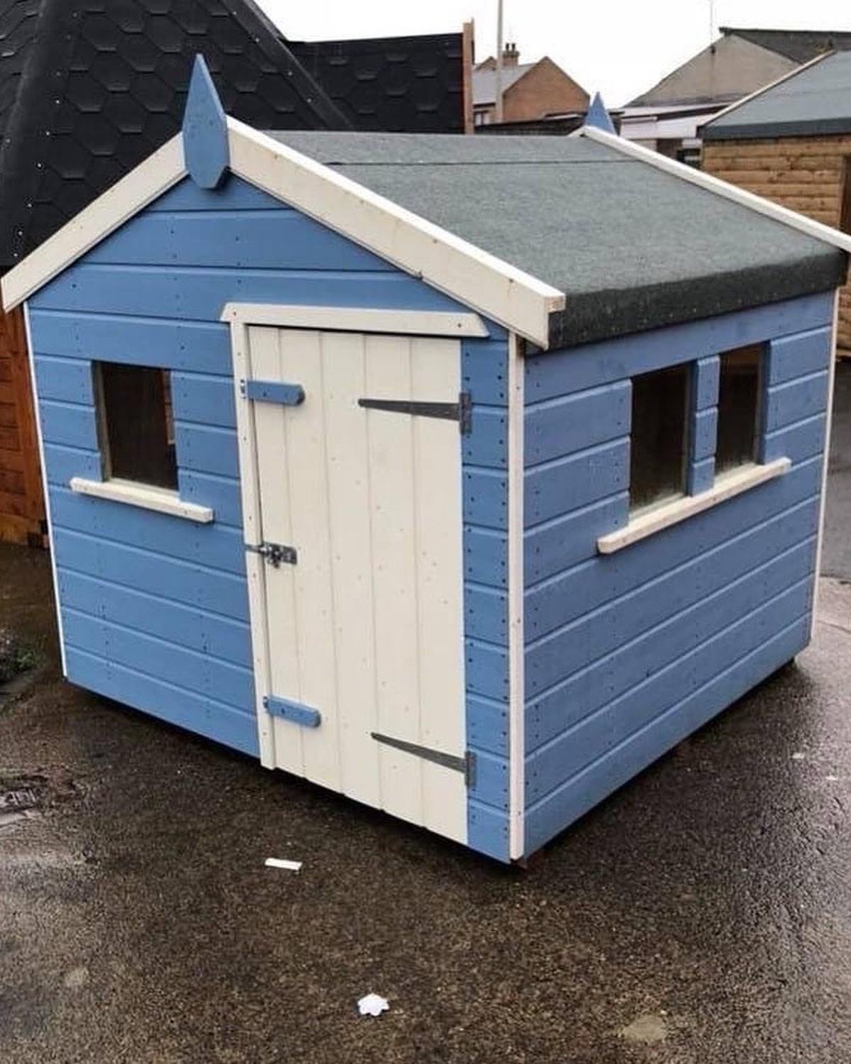 Small blue and white painted wooden children's playhouse with an apex roof | Signature Garden Rooms, Central Scotland