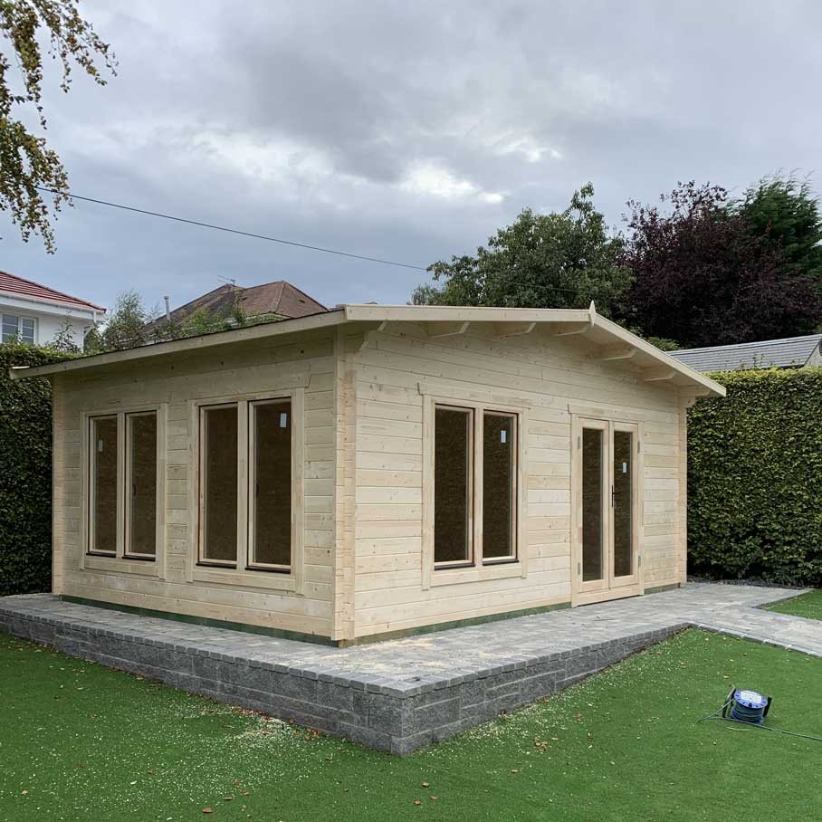 Large untreated timber log cabin with double doors and multiple double-glazed windows | Signature Garden Rooms, Central Scotland