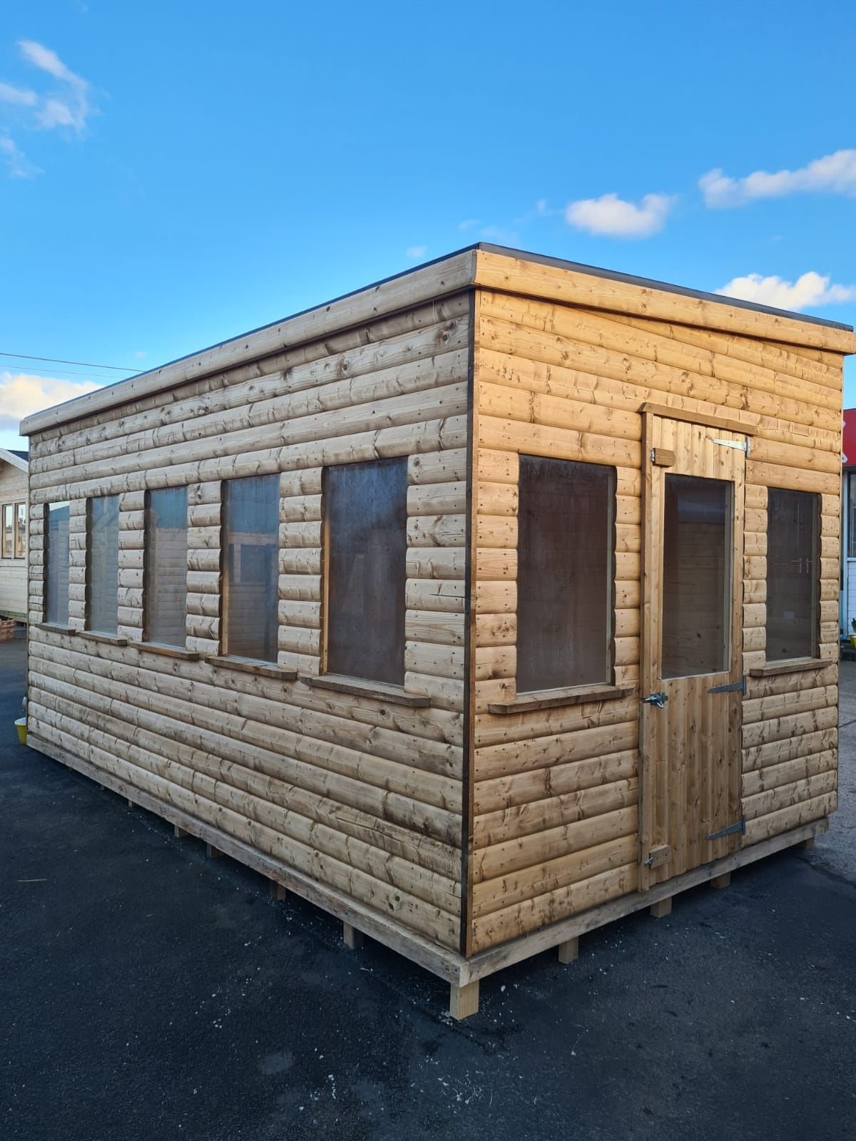Large wooden garden workshop shed featuring multiple glass windows and single door | Signature Garden Rooms, Central Scotland