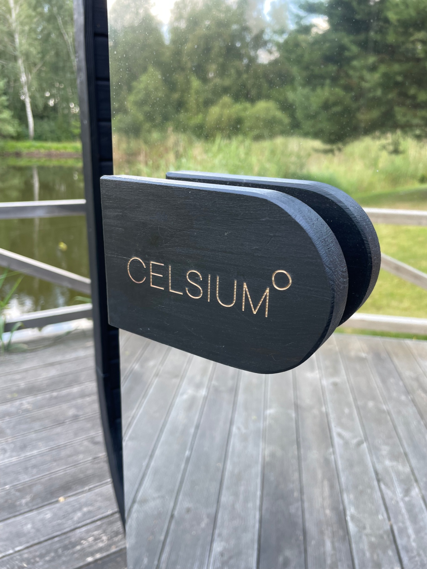 Ula Mini curved cube sauna in ebony charred finish | Signature Garden Rooms