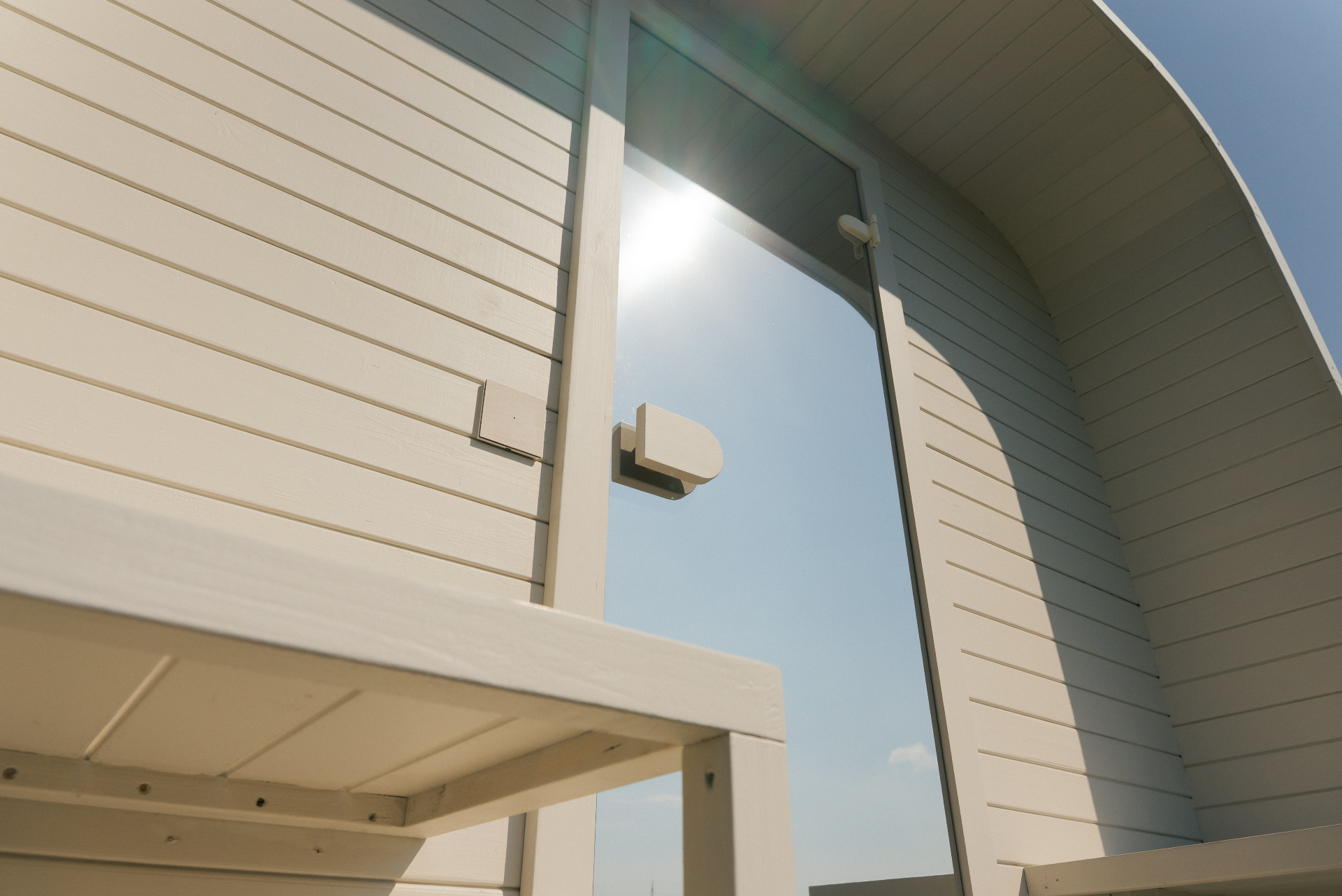 Ula L curved-corner cube sauna in beige cedar finish | Signature Garden Rooms Scotland