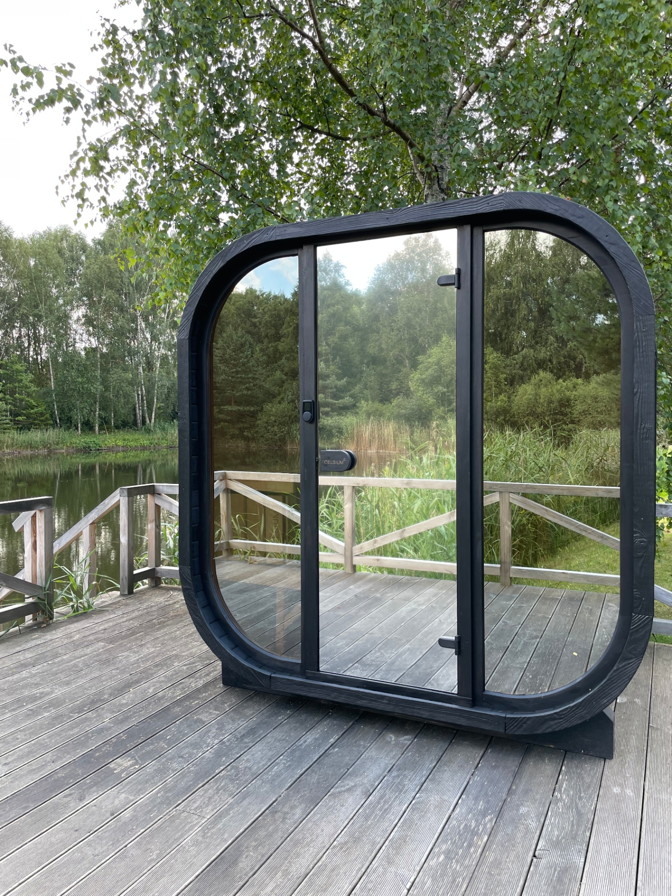 Ula Mini curved cube sauna in ebony charred finish | Signature Garden Rooms